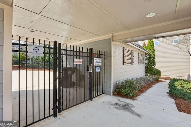 exterior space with fence and a gate