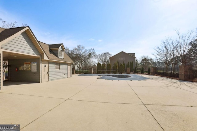 view of side of home with fence