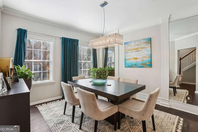 dining area featuring stairs, crown molding, baseboards, and dark wood-type flooring