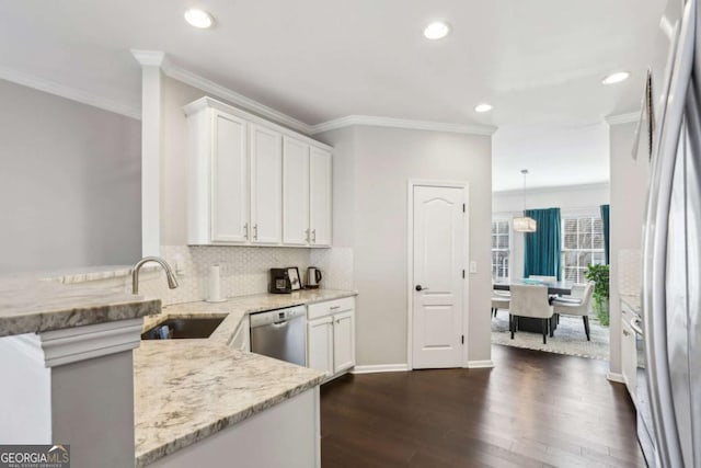 kitchen with dark wood-type flooring, a sink, light stone counters, stainless steel dishwasher, and white cabinetry