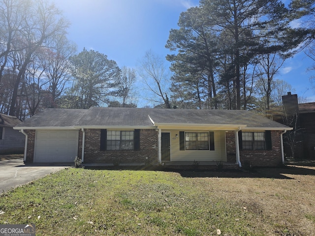 432 Independence Dr, Jonesboro, GA 30238 - ranch-style home featuring brick siding, an attached garage, a front lawn, and driveway