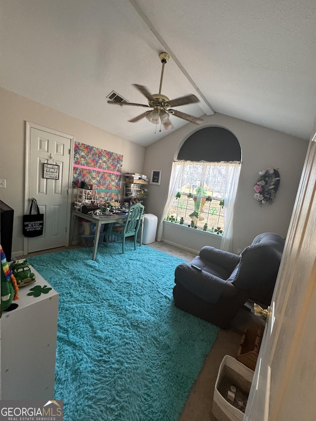 carpeted living area featuring lofted ceiling with beams, visible vents, a textured ceiling, and ceiling fan