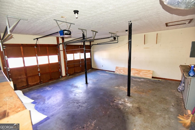 garage featuring electric panel, baseboards, and a garage door opener