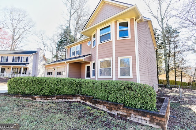 view of front of home with fence