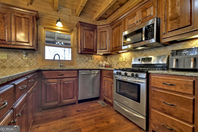 kitchen with dark wood-style floors, a sink, wood ceiling, appliances with stainless steel finishes, and beamed ceiling