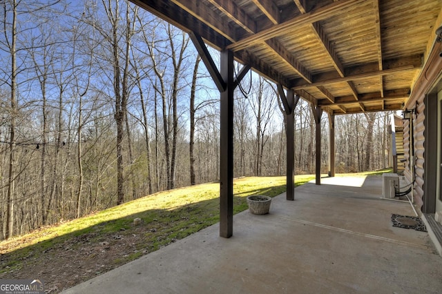 view of patio with a wooded view