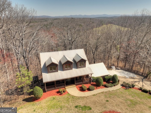 bird's eye view with a mountain view and a wooded view