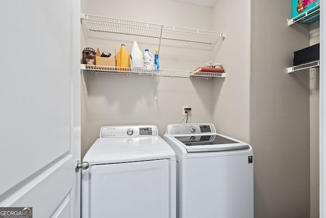 laundry room featuring laundry area and washer and clothes dryer