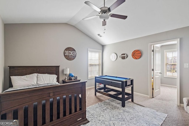 bedroom with baseboards, multiple windows, carpet, and lofted ceiling