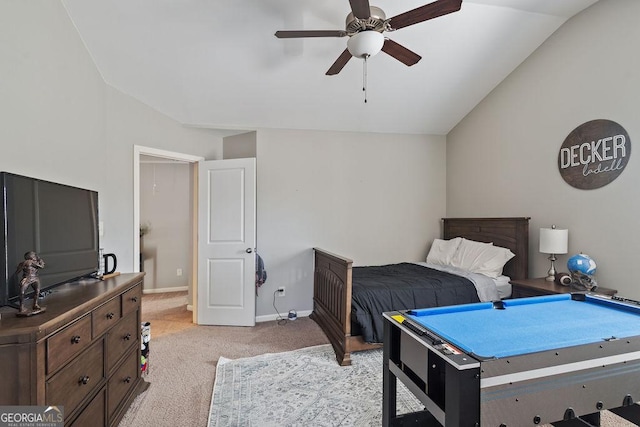 bedroom with baseboards, light carpet, ceiling fan, and vaulted ceiling