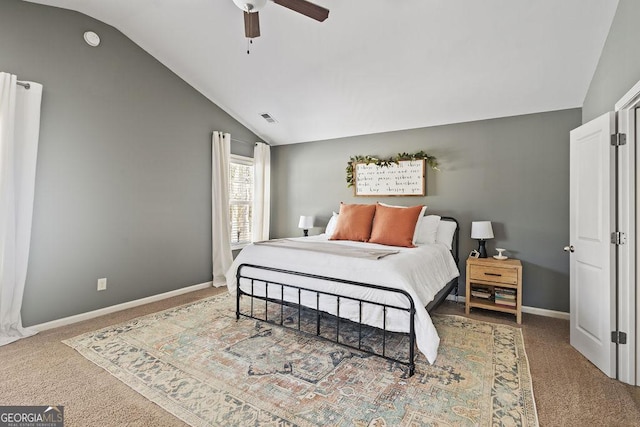 carpeted bedroom featuring visible vents, baseboards, ceiling fan, and vaulted ceiling