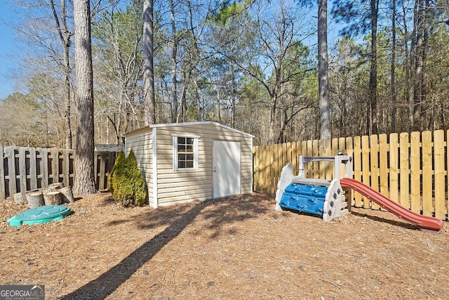 view of shed featuring a fenced backyard