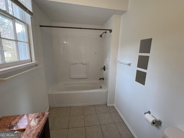 bathroom with tile patterned flooring, toilet, baseboards, and shower / bathtub combination