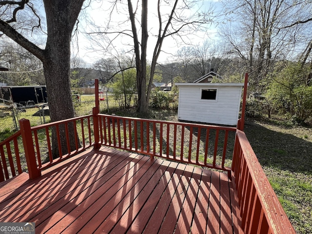 deck featuring an outbuilding and a shed