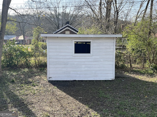 view of shed with fence