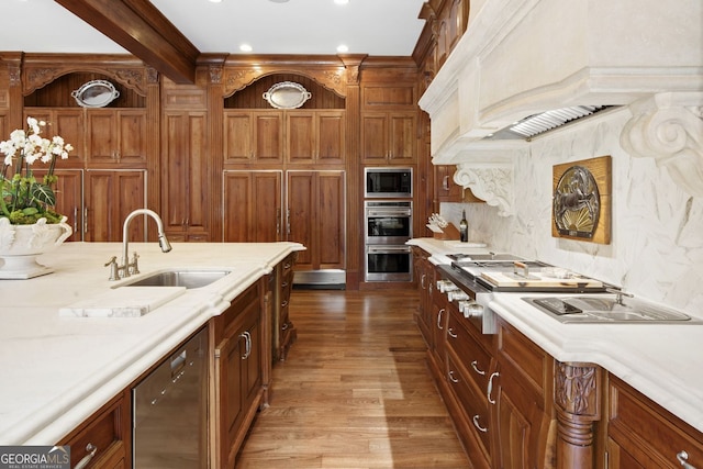 0 Winterthur, Sandy Springs, GA 30328 - kitchen with appliances with stainless steel finishes, a sink, light countertops, dark wood-style floors, and decorative backsplash