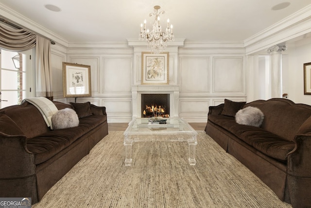 0 Winterthur, Sandy Springs, GA 30328 - living area with a decorative wall, a chandelier, crown molding, a lit fireplace, and wood finished floors