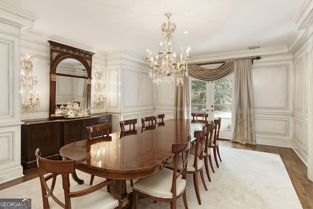 0 Winterthur, Sandy Springs, GA 30328 - dining area featuring a decorative wall, a chandelier, wood finished floors, french doors, and crown molding