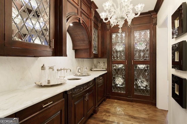 0 Winterthur, Sandy Springs, GA 30328 - bar area featuring a sink, a chandelier, wood finished floors, and crown molding