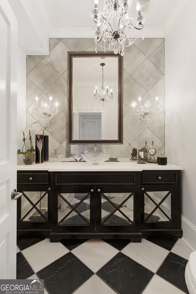 0 Winterthur, Sandy Springs, GA 30328 - bathroom featuring a chandelier, tile walls, crown molding, vanity, and toilet
