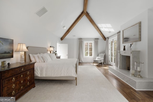 0 Winterthur, Sandy Springs, GA 30328 - bedroom with beamed ceiling, wood finished floors, a fireplace, and high vaulted ceiling