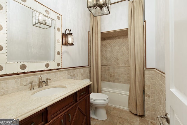 0 Winterthur, Sandy Springs, GA 30328 - full bath with tile walls, toilet, vanity, shower / bath combo with shower curtain, and a wainscoted wall