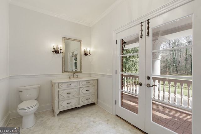 0 Winterthur, Sandy Springs, GA 30328 - bathroom with french doors, toilet, wainscoting, crown molding, and vanity