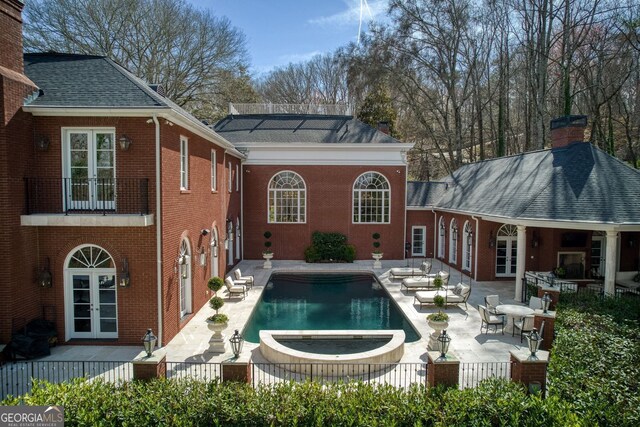 0 Winterthur, Sandy Springs, GA 30328 - rear view of house with french doors, brick siding, a chimney, a patio area, and fence