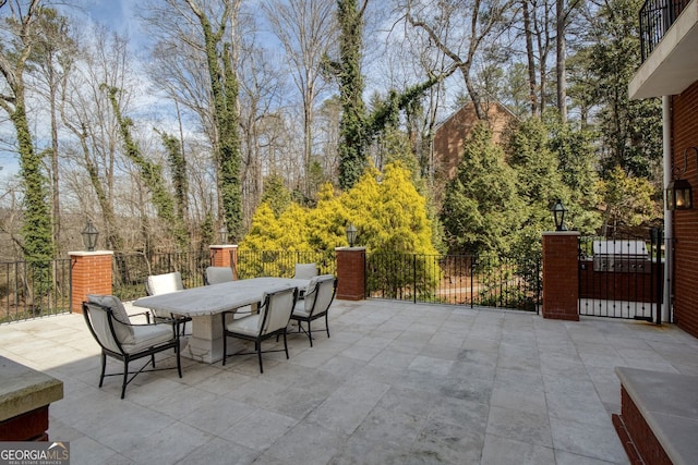 0 Winterthur, Sandy Springs, GA 30328 - view of patio featuring outdoor dining space and fence