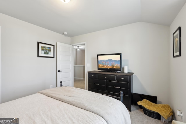 carpeted bedroom featuring vaulted ceiling