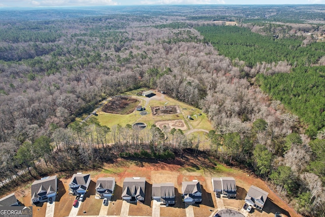 birds eye view of property with a residential view and a forest view