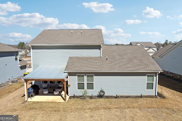 back of house with central AC, a yard, a patio area, and roof with shingles