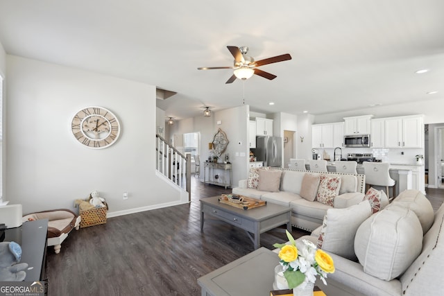 living area with recessed lighting, baseboards, ceiling fan, and dark wood finished floors