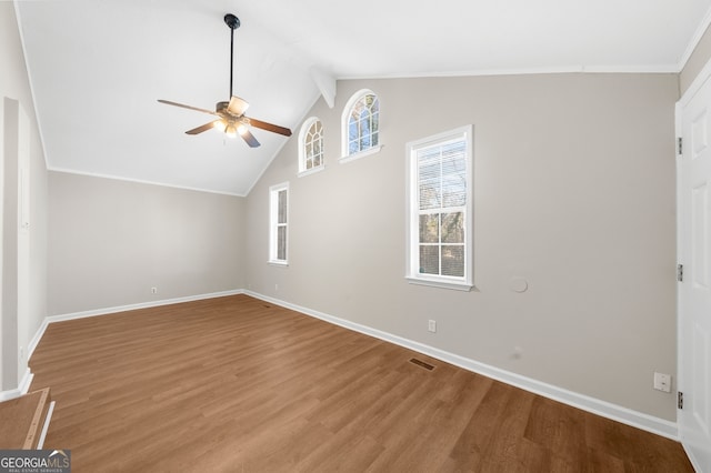 unfurnished living room featuring visible vents, baseboards, wood finished floors, and a ceiling fan