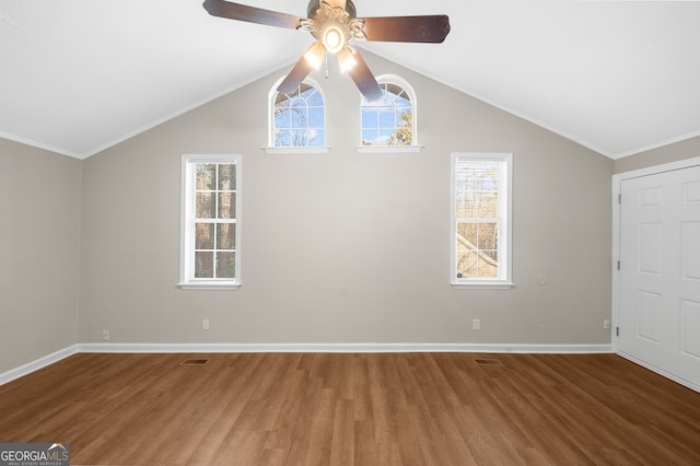 additional living space with wood finished floors, a ceiling fan, baseboards, and lofted ceiling