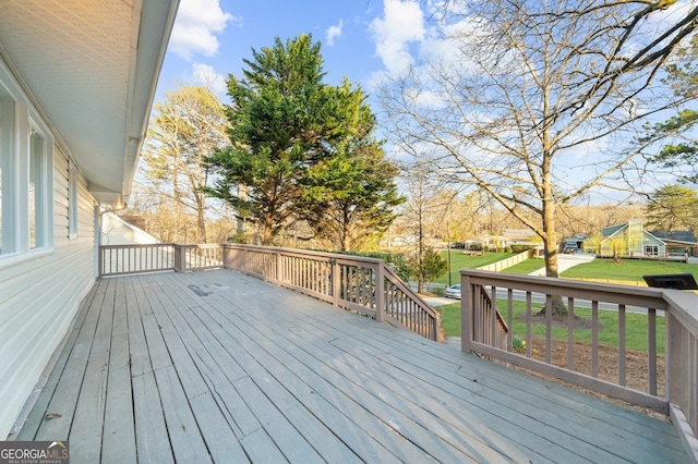 deck featuring a lawn