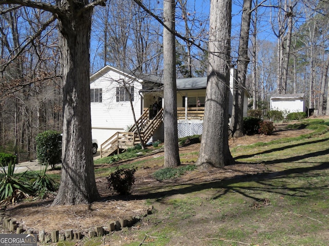 view of front of home featuring stairs