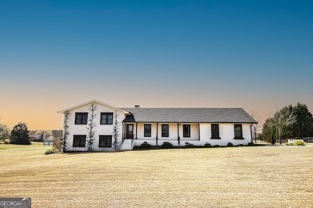 tri-level home featuring a lawn