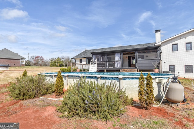 outdoor pool with a sunroom