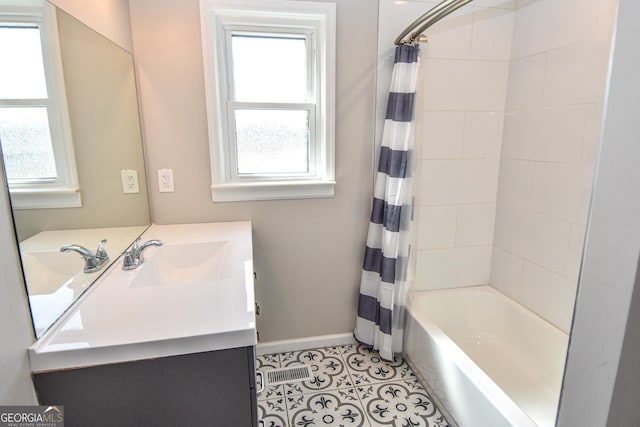 bathroom with baseboards, shower / bath combination with curtain, vanity, and tile patterned flooring