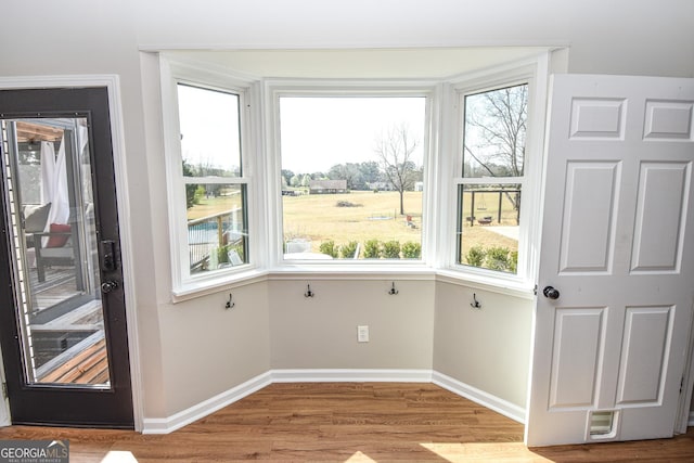 unfurnished sunroom featuring visible vents