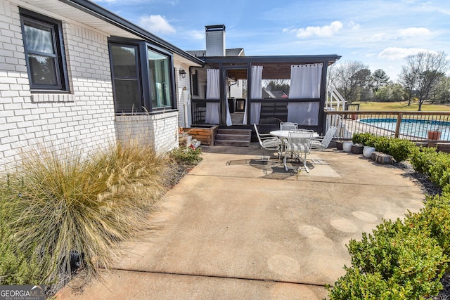 view of patio featuring a fenced in pool