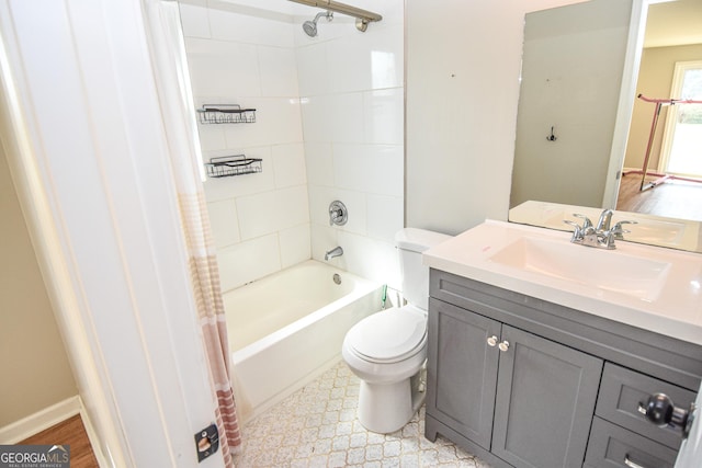 full bath with vanity, toilet, and shower / bath combo