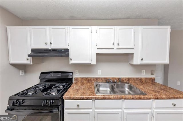 kitchen featuring a sink, under cabinet range hood, a textured ceiling, gas stove, and white cabinets