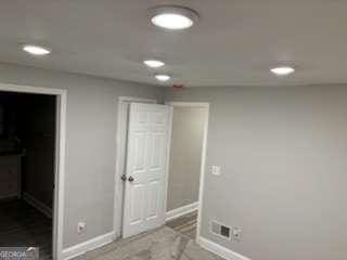 interior space featuring recessed lighting and baseboards