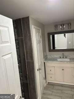 bathroom featuring vanity and wood finished floors