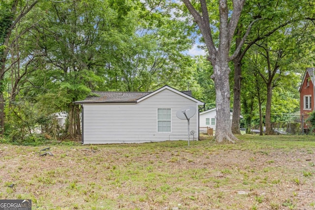 view of property exterior with a lawn