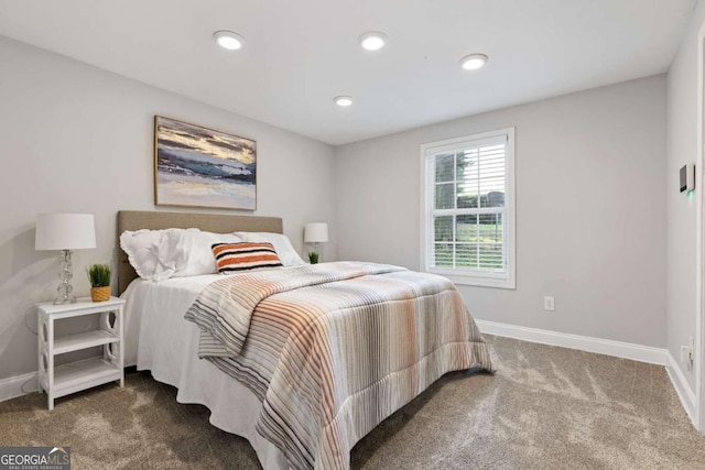 carpeted bedroom featuring recessed lighting and baseboards