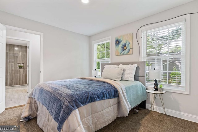 bedroom featuring carpet flooring and baseboards