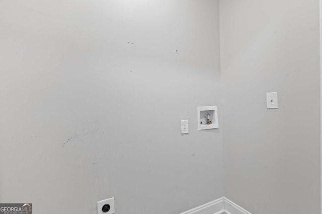 washroom featuring laundry area, hookup for a washing machine, electric dryer hookup, and baseboards